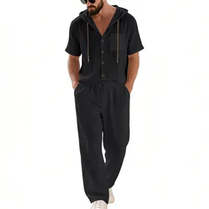 Detailed view of a men's black linen two-piece set with a hooded shirt and long trousers