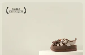 Side view of toddler girl's cartoon Roman sandals with soft non-slip soles on a podium