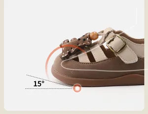 Detailed view of toddler girl's brown sandal showing the 15-degree toe spring design