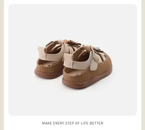 Rear view of brown and beige toddler sandals with soft anti-slip rubber soles.