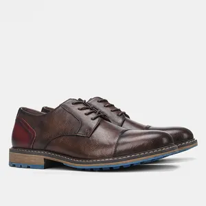 Premium vintage brown leather cap-toe derby shoes with unique red heel and blue sole detail