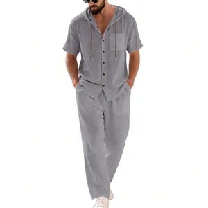 Full-length view of men's grey linen short-sleeve hooded shirt and trousers set.