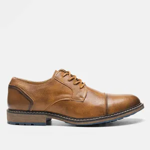 Detailed side view of vintage brown men's casual leather dress shoe with cap toe