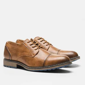 Detailed view of brown vintage men's dress shoes with a textured grain leather finish