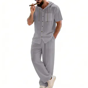 Full view of men's loose linen hooded shirt and trousers set in grey for summer