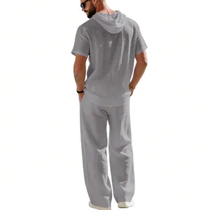 Back view of men's loose breathable linen hooded shirt and trousers set in grey color