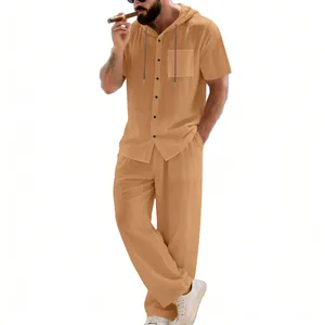 Man wearing a loose apricot linen-blend hooded short-sleeve shirt and matching pants