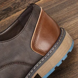 Close-up detail of vintage brown leather shoe heel featuring textured blue slip-resistant sole