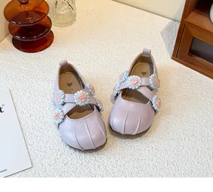 Detailed view of purple girls' Mary Jane shoes with delicate flower decorations