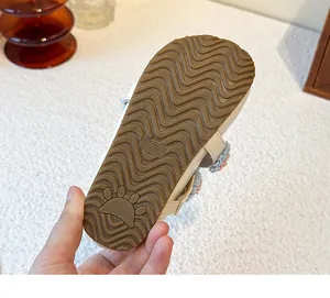 Detailed macro view showing the non-slip wavy pattern on a toddler shoe rubber sole