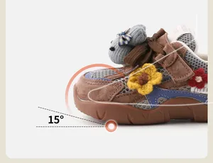 Close-up of baby sneaker featuring 15-degree toe lift and cute 3D animal decorations.