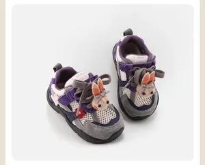 Toddler purple sneakers with mesh fabric and a cute plush bunny charm decoration