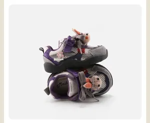 Detail view of purple baby running shoes featuring cute rabbit and flower decorations