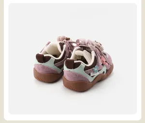 Toddler soft-sole non-slip sneakers featuring knit flower detail and pink rope laces