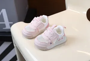 Detailed macro view of breathable mesh toddler shoes featuring a cute pink panda paw design