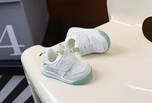 Detailed view of breathable mesh panda walking shoes for toddlers in white and green