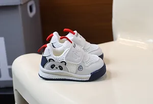 Close-up of breathable mesh baby walking shoes featuring a cute panda character design