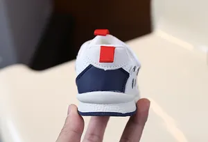 Heel view of breathable panda sneakers for toddlers with mesh upper and red pull tab