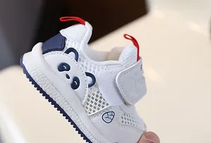 Close-up of breathable mesh toddler shoes featuring a cute panda design and soft sole.