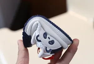 Close-up of flexible panda-themed mesh baby walking shoe showing its soft sole