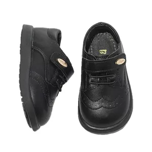 Classic black girls' Oxford shoes with brogue detailing and soft sole for school or parties.