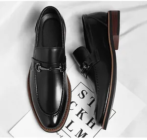 Classic men's black leather loafers with metal horsebit buckle for business attire