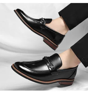 Side detail of premium black leather dress shoes with metal buckle for formal wear