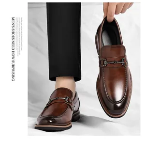 Close-up detail of premium men's brown leather dress shoes with elegant horsebit buckle