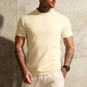 Close-up of beige men's t-shirt showing fabric texture and athletic slim fit.