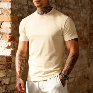 Detail shot of men's athletic fit crew neck t-shirt in cream color shown on model
