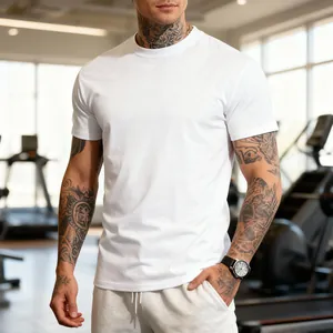 Close-up of a white men's quick-dry fitness t-shirt on a tattooed athletic model