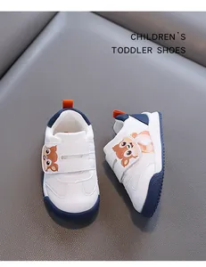 White toddler walking shoes featuring cartoon squirrel design and non-slip soft soles