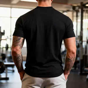 Rear view detail of a black slim-fit performance gym t-shirt on a muscular male model.