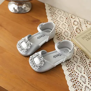 Elegant silver girls' princess shoes with sparkling rhinestone buckle and soft, comfortable sole.