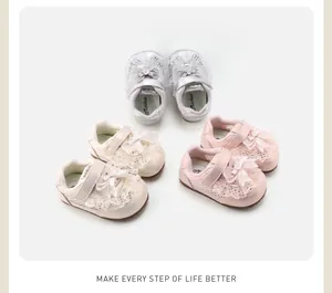 Detailed view of three pairs of toddler shoes with elegant lace and bow decorations