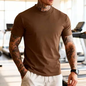 Close-up of brown men's fitness t-shirt showing breathable fabric in a professional gym