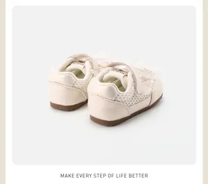 Detail of cream toddler girls' lace bow sneakers showing heel and mesh texture.