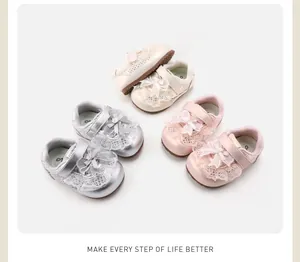 Close-up view of anti-slip toddler girl shoes featuring delicate lace bows and velcro