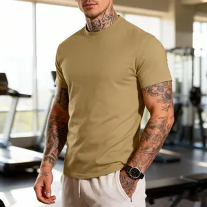 Athletic men's khaki crew neck t-shirt shown in a gym setting for fitness enthusiasts