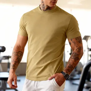 Detail of olive green athletic T-shirt showing fit and breathable fabric in a gym.