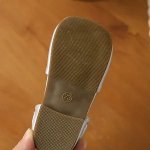 Close-up detail of the durable non-slip soft rubber sole on girls' white princess shoes