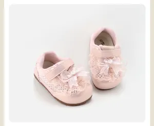 Detailed view of pink toddler girl shoes with lace and bow design, anti-slip sole