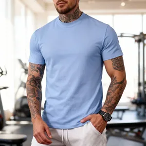 Men's slim fit sports crew neck t-shirt in light blue, shown in a modern gym setting