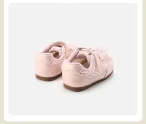 Close-up rear view of pink toddler girl sneakers featuring bow detail and breathable mesh
