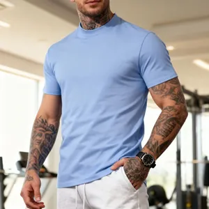 Close-up of a men's light blue breathable crew neck t-shirt in a gym setting