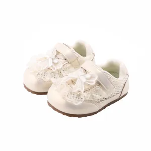 Elegant cream lace baby girl shoes with decorative bows and non-slip rubber soles