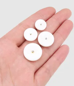 Macro view of premium white mother of pearl shell buttons showing natural texture