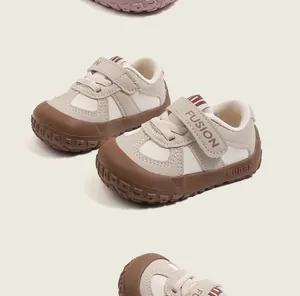 Close-up of beige and brown toddler walking shoes with soft soles and anti-slip design