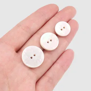 Natural white mother of pearl shell buttons in three sizes for premium clothing