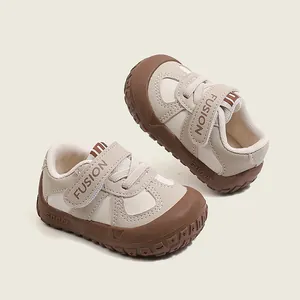Non-slip baby walking shoes with soft sole and protective toe cap in beige and brown